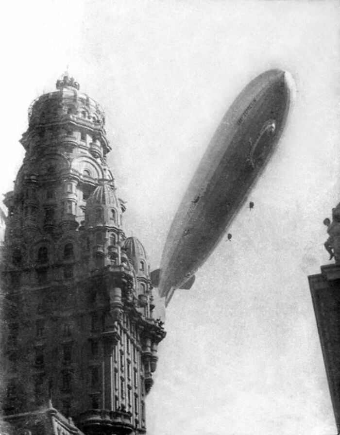 an old black and white photo of a large balloon in the air