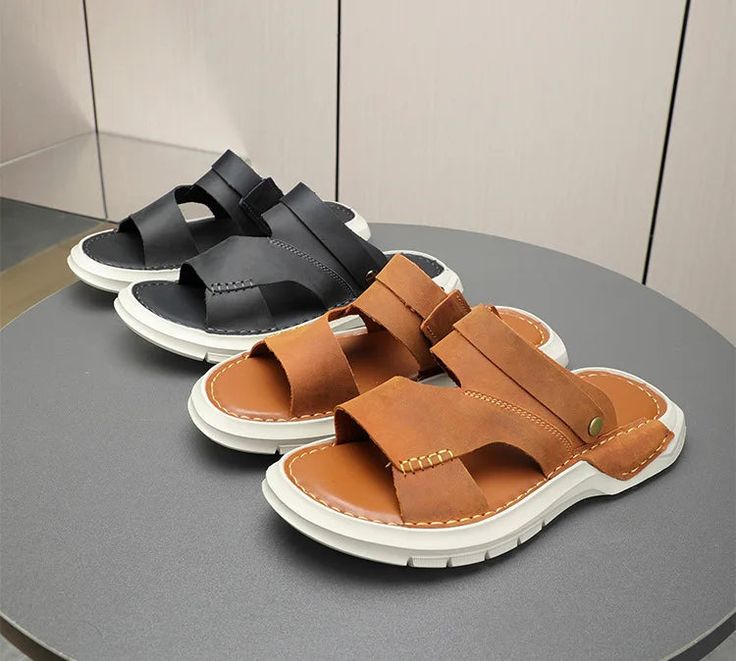 Experience unparalleled comfort adorning this enchanting pair of sandals, crafted with a comfortable rubber outsole and bonded leather insole. Men will be thrilled to wear these sandals, a combination of blissful comfort and style. With a genuine leather upper, these dazzling sandals are ideal for various occasions. Have you tried them yet? Specifications Brand Name: GeraldBlack Upper Material: Genuine LeatherUpper-Genuine Leather Type: Cow LeatherSandal Type: BasicStyle: ConciseOrigin: Mainland ChinaOccasion: CasualOutsole Material: RubberHeel Height: Low (1cm-3cm)Pattern Type: SolidInsole Material: Bonded LeatherFit: Fits true to size, take your normal sizeModel Number: SHOE-TR-2330Lining Material: NONEClosure Type: Elastic bandItem Type: SandalsFashion Element: SewingDepartment Name: Ad Ortholite Insole Sandals For Outdoor Summer Activities, Leather Slippers With Cushioned Footbed For Vacation, Leather Sport Sandals With Ortholite Insole For Summer, Summer Leather Sport Sandals With Ortholite Insole, Leather Beach Slippers With Round Toe, Brown Non-slip Sandals For Vacation, Leather Non-slip Slip-on Sport Sandals, Non-slip Leather Slip-on Sport Sandals, Leather Slide Slippers For Beach