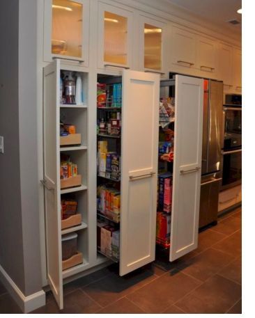 a kitchen with two white refrigerators in it's side by side cabinets and an oven