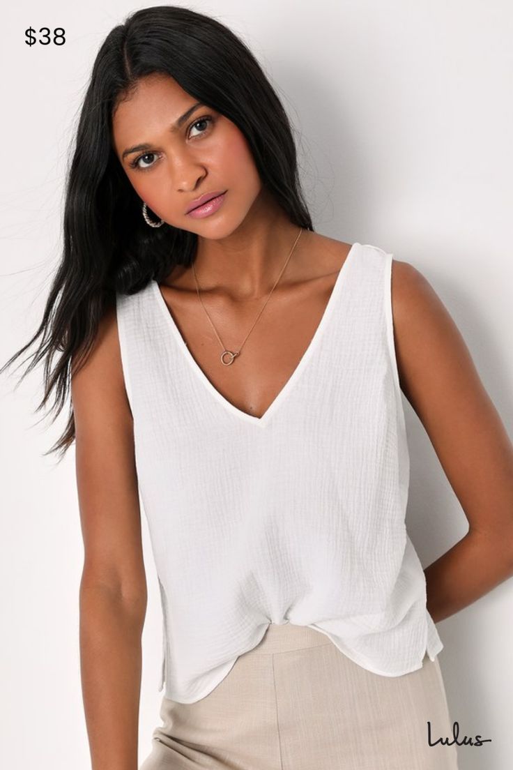 You'll have an easy, breezy season with the Lulus Summer Spirit White Cotton Tank Top in your wardrobe! Gauzy woven cotton shapes this summer-ready tank top that has wide straps and a V-neckline (and back). A relaxed, darted bodice falls to a slightly cropped hem with cute notched accents on the sides. Pair with your favorite high-waisted bottoms and sandals for the perfect warm weather look! Length: Size medium Fabric: Fabric has no stretch. Unlined. 100% Cotton. Hand Wash Cold. Do Not Bleach. Versatile V-neck Tank Top For Everyday, Versatile V-neck Tank Top For Summer, Everyday Cotton V-neck Tank Top, Summer Vacation V-neck Tank Top, Trendy V-neck Tank Top For Beach, Summer V-neck Tank Top For Day Out, V-neck Tank Top For Day Out In Spring, Summer V-neck Camisole For Vacation, Chic V-neck Camisole For Day Out