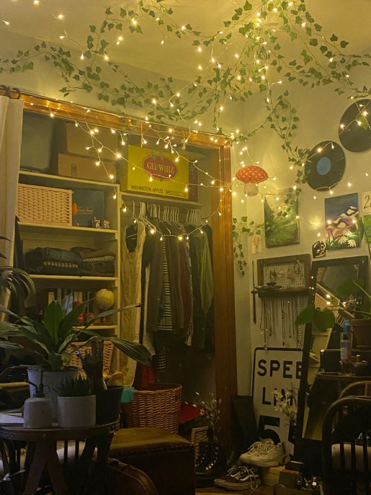 a room filled with lots of furniture and lights hanging from the ceiling next to a mirror