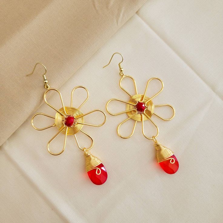 These delicate and bohemian hoops are inspired by the seasonal and red colors that make them combine with almost all your looks and outfist, they are very romantic and bearable because they are a modern classic that can not miss in your closet. Handmade Simply beautiful, these gold filled wire embroidered Beaded hoop earrings, unique designed and crafted earrings designed in modern women and seasonal colors. Collection of special earrings made for you, a unique fashionista and chic woman who is Red Flower Drop Earrings, Red Bohemian Flower Earrings, Red Bohemian Flower Pendant Jewelry, Bohemian Red Flower Earrings, Bohemian Red Flower Pendant Jewelry, Bohemian Wire Wrapped Flower Earrings, Handmade Red Flower Earrings For Gift, Handmade Red Flower Earrings As Gift, Red Bohemian Dangle Flower Earrings