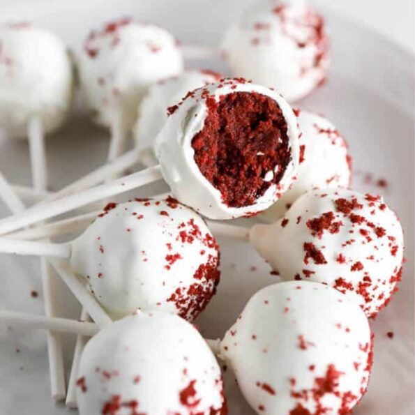 red velvet cake pops on a white plate