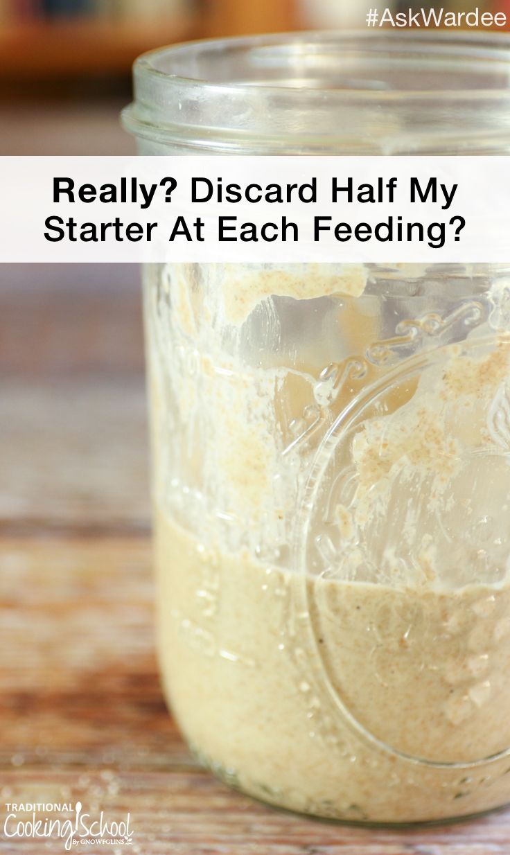 a jar filled with food sitting on top of a wooden table