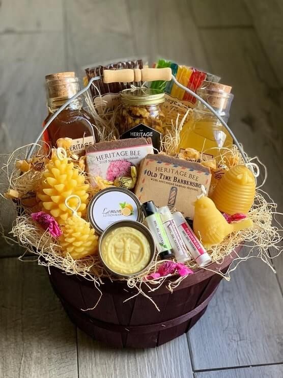 a basket filled with lots of different types of condiments and liquor in it