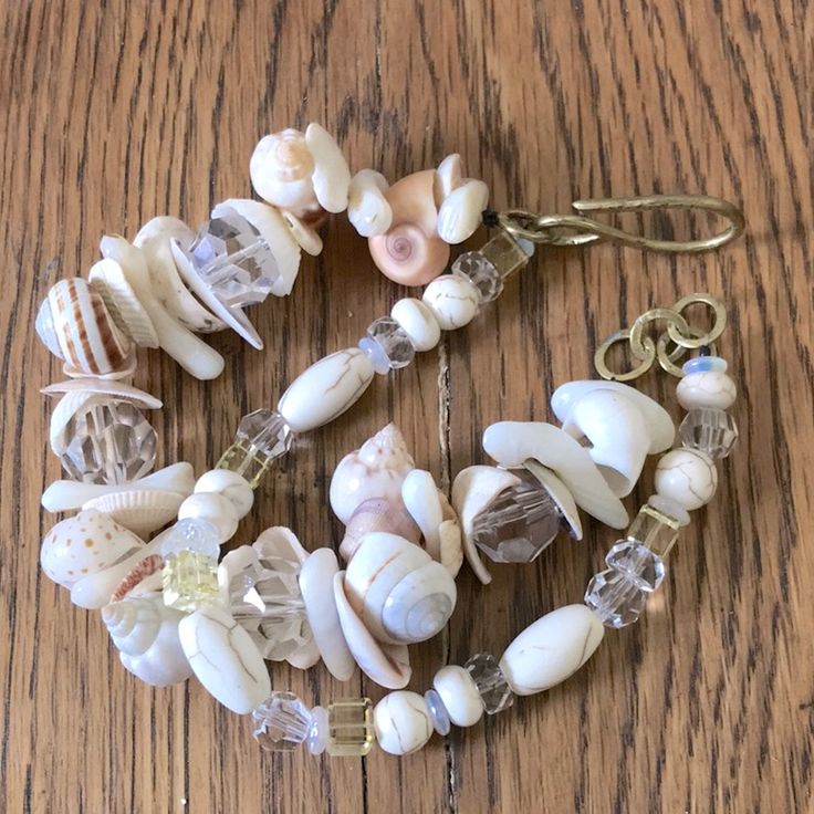 Crystal Sea Shell From North Carolina And Virginia Shores. Solid Brass Handmade Clasp. Real Glass Crystals. Many Years Of Collecting. 8” But Fits A Wide Range Of Wrists. Has Extender Ring. I Have Made Another Smaller One, So Check That One Out Along With My Other Artisan Handmade Bracelets. Tags: Coastal, Boho, Maximalist, Beach, Beachy, Handmade, Treasure Chest, Gift Jewelry, Brass Sea Glass Jewelry Bracelets, Maximalist Jewelry, Boho Style Bracelets, Dragon Bracelet, Coastal Boho, Large Bracelet, Purple Quartz, Elephant Bracelet, Beach Bracelets