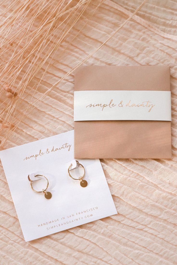 Our Tiny Coin Hoops are perfect, simple earrings that go well with just about everything! They'll add a fun dangle and shine to your look. They're perfect for everyday wear, as they're made of gold fill or sterling silver - materials durable for daily use!  The best part is that they don't tarnish... and they're affordable! Find more at Simple & Dainty. Photo credit: https://www.instagram.com/helloimaubs/ Hypoallergenic 14k Gold Filled Dangle Huggie Earrings, Gift Recycled Gold Tarnish Resistant Hoop Earrings, Nickel-free Small Hoop Earrings In 14k Gold Filled, Silver 14k Gold Filled Hoop Earrings For Gift, Gift Recycled Gold Tarnish-resistant Hoop Earrings, Gift Tarnish Resistant Recycled Gold Hoop Earrings, Silver 14k Gold Filled Hoop Earrings As Gift, Recycled Gold Huggie Earrings Gift, Gift 14k Gold Dangle Hoop Earrings