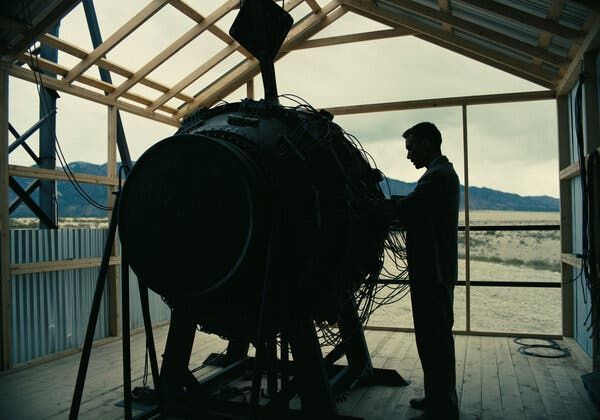 a man standing in front of a large machine