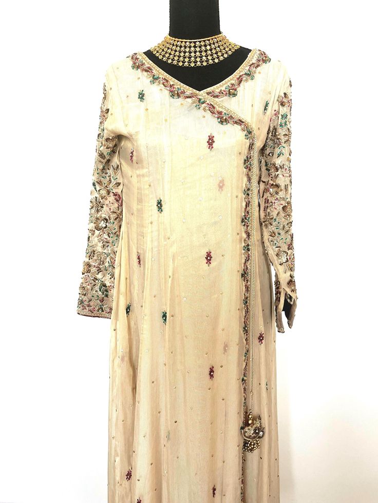 Handpicked and curated  wedding formal designer desi kameez and shalwar designed by a private designer in California. Long Sleeve Raw Silk Anarkali Set With Sheer Dupatta, Designer Floor-length Cream Salwar Kameez, Designer Cream Floor-length Salwar Kameez, Cream Silk Anarkali Set, Anarkali Salwar Kameez With Mirror Work For Designer Wear, Silk Anarkali Set With Mirror Work And Long Sleeves, Designer Transitional Floor-length Kurta, Eid Anarkali Salwar Kameez In Raw Silk, Silk Anarkali Set With Dabka Work And Long Sleeves