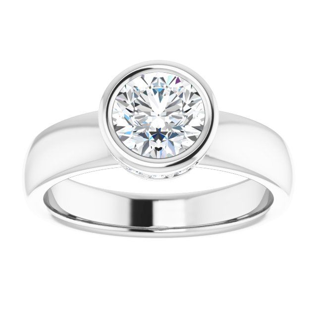 a white gold ring with a round brilliant diamond