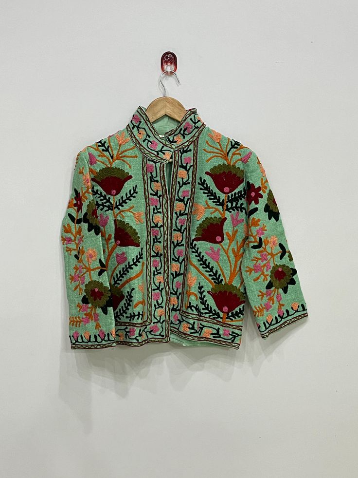 Suzani Hand Embroidery Jacket Women Wear Winter Jacket Indian Suzani Jacket Bohemian Style Cotton Jacket Women's Clothing Gift For Her Introducing our stunning Embroidered Suzani Jacket, this jacket is the perfect statement piece for any occasion, this jacket is a unique piece that showcases traditional artistry, this Embroidered Suzani Jacket is a versatile worn casually with jeans And Boots Or Silk Long Tanks And Palazzo Pant. Add this Embroidered Suzani Jacket to your collection today and sta Bohemian Embroidered Nehru Jacket For Winter, Bohemian Nehru Jacket With Intricate Embroidery For Winter, Folk Style Outerwear With Intricate Embroidery For Spring, Folk Outerwear With Intricate Embroidery For Festive Occasions, Traditional Green Nehru Jacket For Spring, Festive Folk Embroidered Outerwear, Bohemian Nehru Jacket With Floral Embroidery For Winter, Folk Style Embroidered Outerwear For Fall, Spring Folk Outerwear With Chikankari Embroidery