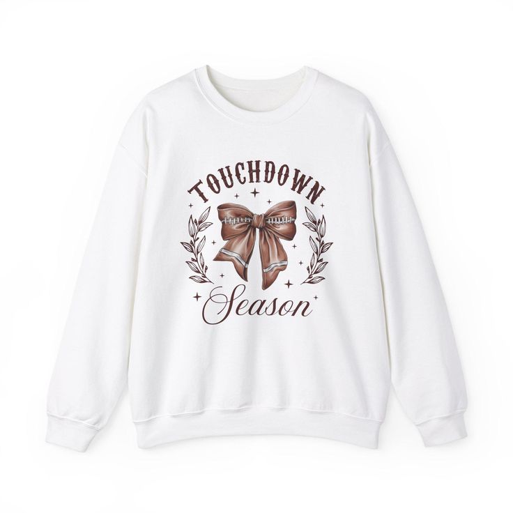 The Touch Down Sweatshirt offers a cozy and comfortable wearing experience with its classic fit and crew neckline. Perfect for colder months, this sweatshirt is made with a medium-heavy fabric blend of 50% cotton and 50% polyester. The double-needle stitching ensures durability, while the seamless design reduces fabric waste. Ideal for those who appreciate quality and comfort, this sweatshirt is perfect for casual wear or lounging at home. Suitable for football enthusiasts and fans of fall and winter seasons. Product features - Medium-heavy fabric blend of 50% cotton and 50% polyester - Classic fit with crew neckline for a comfy wearing experience - Seamless design reduces fabric waste - Durable double-needle stitching at key seams - Suitable for football enthusiasts and fall/winter season White Fleece T-shirt For Winter, Winter Graphic Print Crew Neck Sweats, Winter Fleece T-shirt With Graphic Print, White Graphic Print Sweats For Winter, Fall Slogan Hoodie With Crew Neck, Fall Slogan Crew Neck Hoodie, Winter Letter Print Sweats With Crew Neck, Winter Slogan Crew Neck Sweatshirt, Winter Crew Neck Sweats With Letter Print