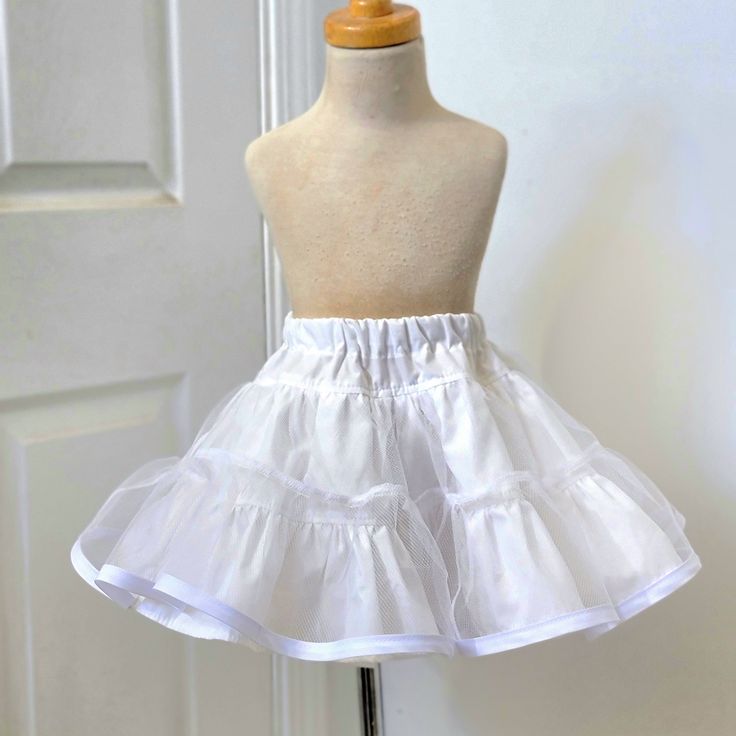 The petticoat is a tiered skirt with two layers of cotton Premium Muslin fabric and one layer of crinoline fabric, it can be worn under dresses or skirts to add that special extra volume. The sizes and measurements are in one of the photos. If you need a different measurement, please ask me. Thank you so much for supporting my small business! Each item is handmade by myself. Quality handmade items take time. I process orders in the order they were received as much as possible. If you need your i Spring Can-can Petticoat In Crinoline, Fitted Full Skirt Petticoat With Ruffles, Fitted Full Petticoat With Ruffles, Full Skirt With Ruffles In Crinoline, Full Crinoline Skirt With Ruffles, Crinoline Tiered Petticoat With Ruffled Skirt, Tiered Ruffled Crinoline Petticoat, Crinoline Tiered Ruffled Petticoat, Stretch Full Skirt Petticoat With Ruffled Detail