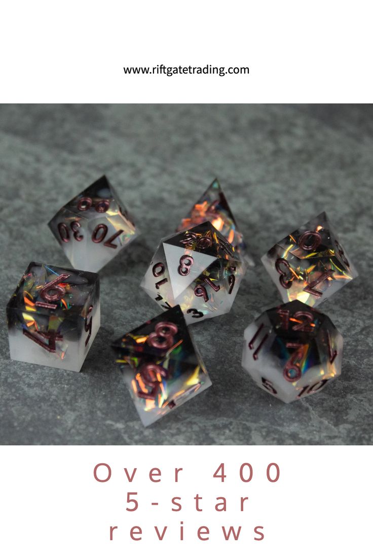 five clear dices with holographic numbers on them sitting on a gray surface