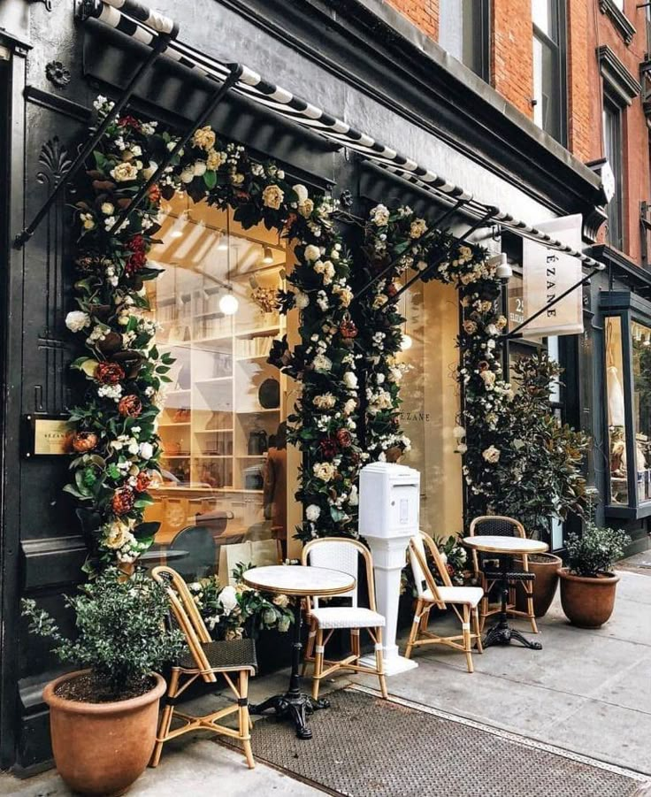 a store front with lots of flowers on it