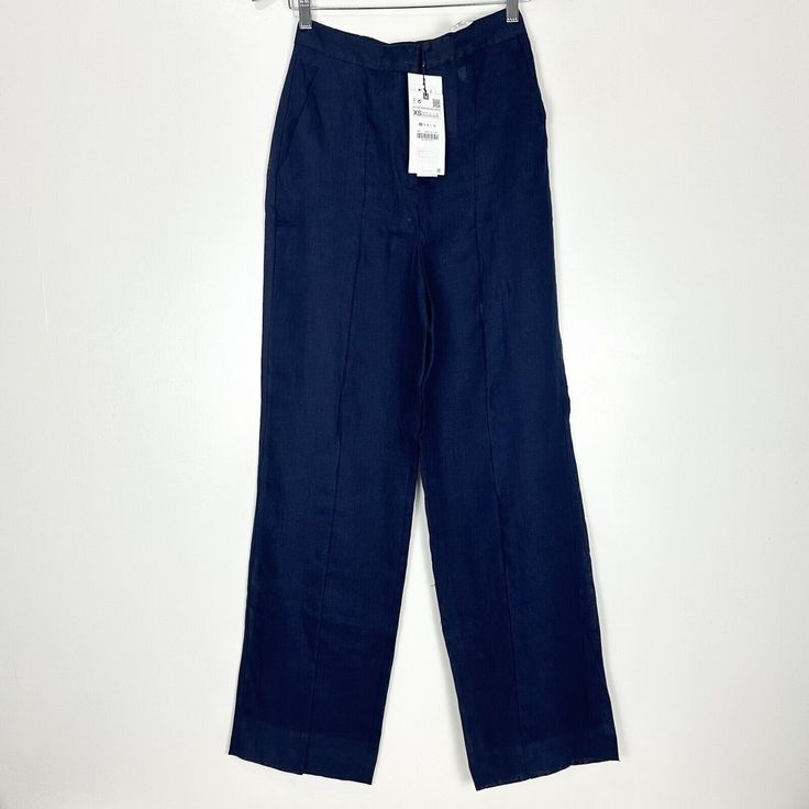 Nwt Zara Trousers 100% Linen Navy Blue Masculine Wide Leg Pant Xs High Waist Summer Size Xs Waist 12.75" Laid Flat Rise 13" Inseam 31" High Rise 100% Linen Zip And Eye Hook Closure Two Front Pocket & Two Faux Back Pockets Semi Sheer Has A Small Hole At The Front Not Noticeable Will Be Circled. Tags: Trendy, On Trend, Vacation, Beach, Resort, Pool Party, Lounge, Travel Indigo Trousers For Workwear, Chic High Rise Indigo Bottoms, Navy Straight Leg Pants For Spring, Indigo Wide Leg Summer Pants, Indigo High Rise Bottoms For Spring, Indigo Fitted Wide Leg Bottoms, Spring Navy Relaxed Fit Bottoms, Zara Wide Leg Denim Blue Bottoms, Navy Relaxed Fit Bottoms For Spring