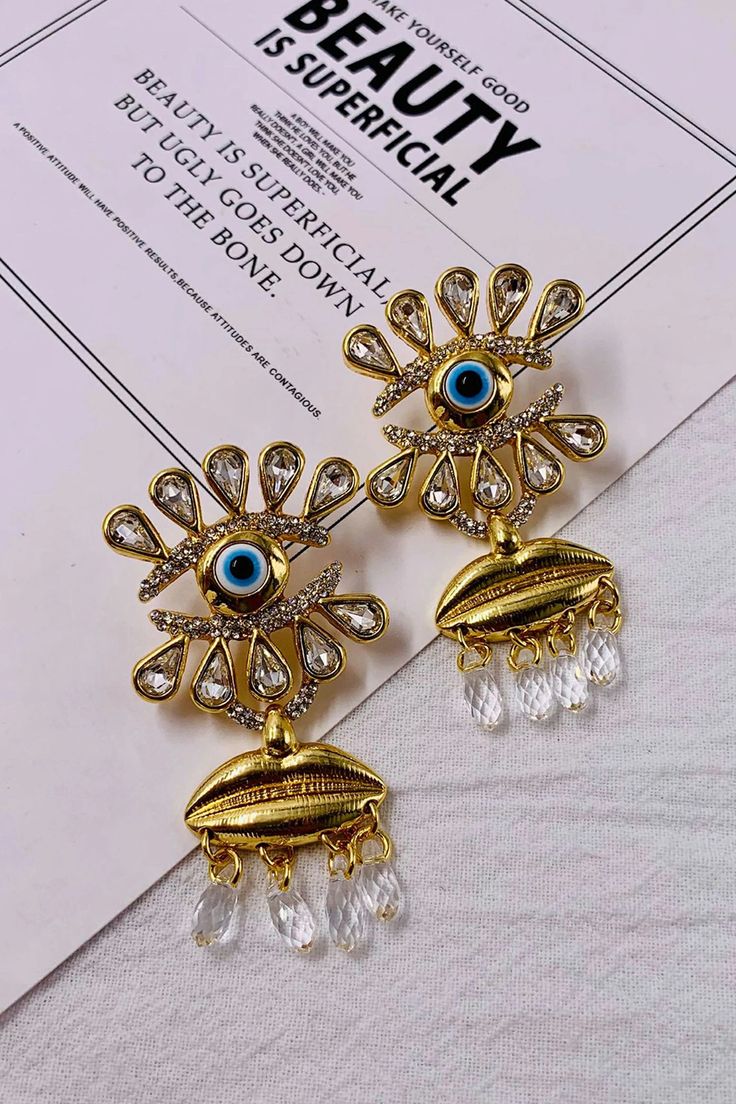 Introducing our Floral Gaze Diamond Gold-Plated Earrings 鈥 a stunning accessory that captures the essence of blossoming flowers and the brilliance of diamonds. Crafted with precision, these earrings not only add a touch of glamour to your ensemble but also showcase the luxurious allure of gold plating. Perfect for both casual and special occasions, these earrings are the epitome of elegance, making you shine with charm and sophistication. Flower Shaped Pierced Earrings For Parties, Round Metal Flower Earrings For Weddings, Party Jewelry With Diamond Eyes, Metal Flower Shaped Earrings For Weddings, Gold Plated Flower Earrings For Party, Dangle Metal Flower Earrings For Wedding, Glamorous Flower Earrings With Cubic Zirconia For Gift, Metal Dangle Flower Earrings For Wedding, Glamorous Cubic Zirconia Flower Earrings For Gift