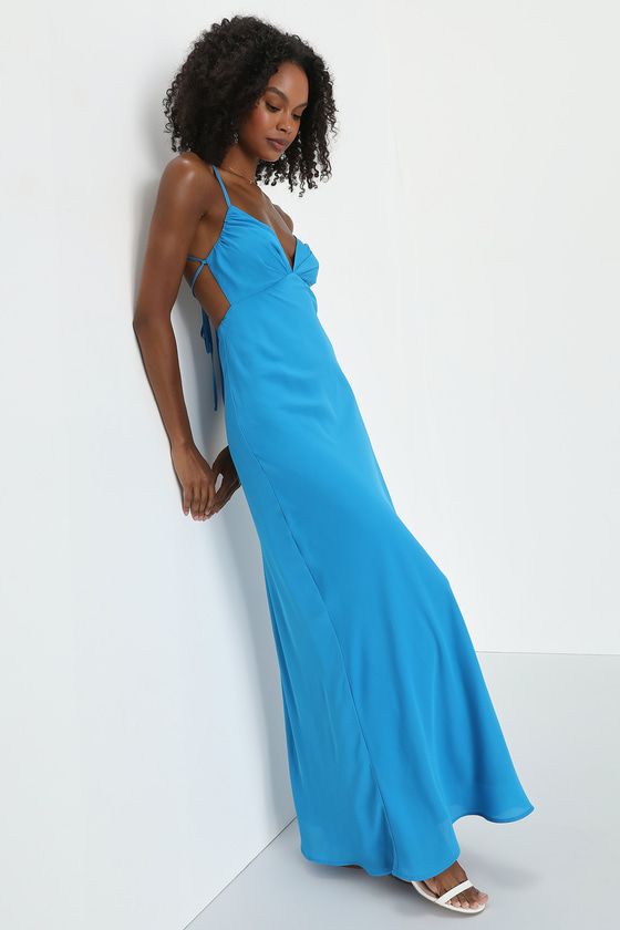 You'll be adored and have them wanting more when you strut into any room wearing the Lulus Mesmerizing Allure Blue Sleeveless Lace-Up Maxi Dress! Lightweight woven chiffon shapes this effortlessly sultry dress that features slender straps that support a sweetheart-neckline and a lightly gathered triangle bodice with a lace-up back design. A wraparound cutout accents the empire waist that sits atop a figure-skimming skirt that falls to a sweeping maxi hem. Hidden back zipper/clasp. Fit: This garm Blue Sleeveless Chiffon Maxi Dress, Blue Chiffon Sleeveless Dress, Sleeveless Lined Maxi Bridesmaid Dress, Blue Chiffon Maxi Dress With Spaghetti Straps, Blue Backless Lined Dress, Blue Lined Backless Dress, Blue Chiffon Sleeveless Party Dress, Blue Chiffon Sleeveless Dress For Party, Blue Fitted Sleeveless Chiffon Dress