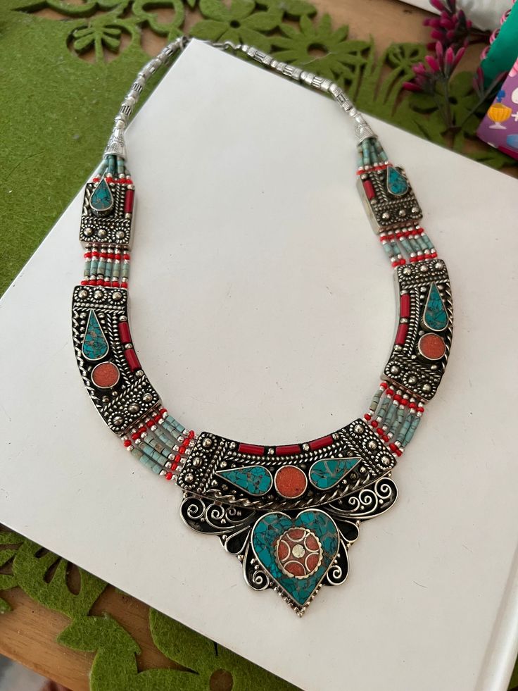 Complement your personality with this trendy unique design.  The gorgeous necklace is beautifully handcrafted by our skilled Indian craftsmen in stones and beads. Material: German Silver.  Weight of the necklace is 120 grams. Turquoise, coral and lapis lazuli. The length of the necklace when falls on the body is approximately 9 inches  Hook closure Beaded Necklaces For Festivals As Gifts, Beaded Necklaces For Festivals And Gifts, Handmade Round Beaded Necklace For Festivals, Festival Gift Necklaces With Colorful Beads, Festive Necklaces With Colorful Beads For Gifts, Festival Gift Necklace With Colorful Beads, Festive Gift Necklaces With Colorful Beads, Artisan Necklaces For Festivals, Artisan Necklace With Round Beads For Festivals