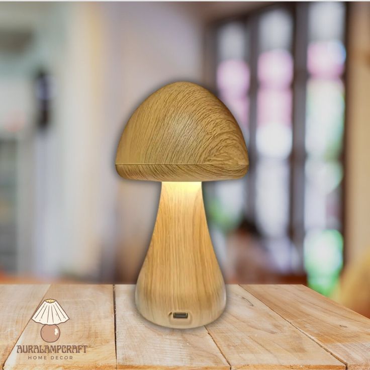 a mushroom lamp sitting on top of a wooden table