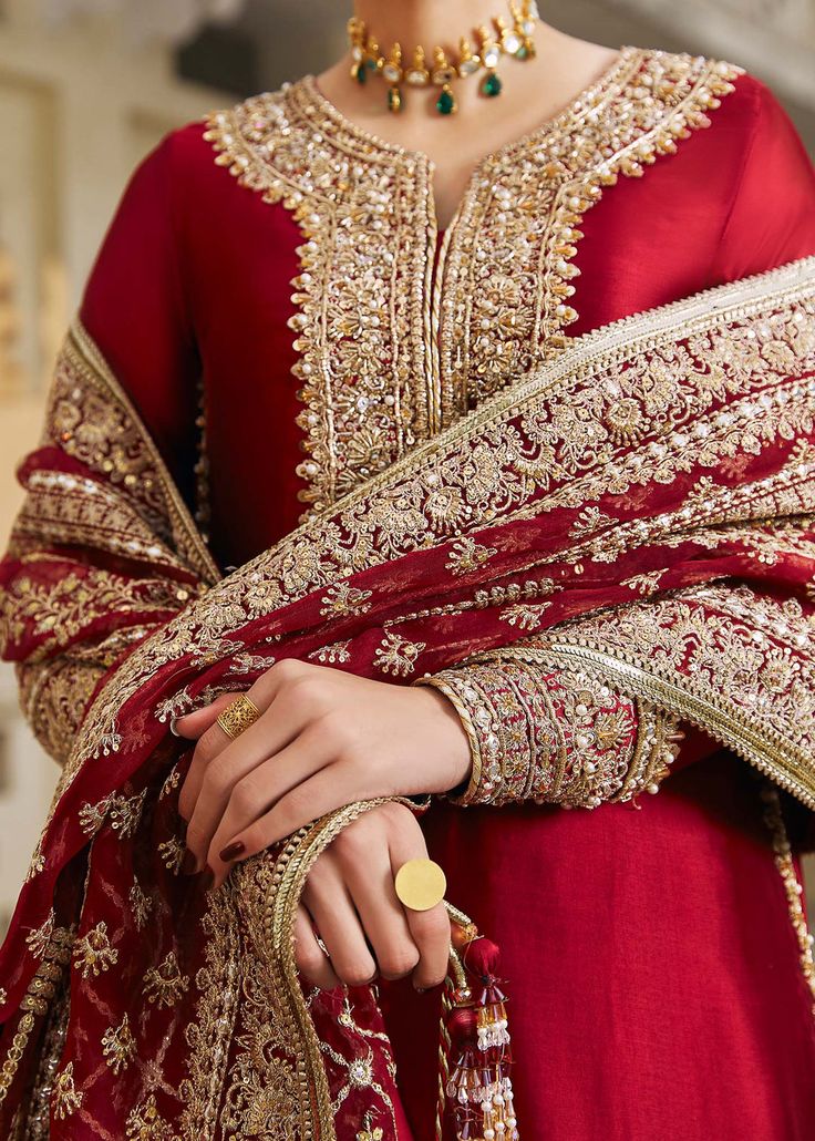 Pakistani Wedding Dress in Kameez Churidar Style is a stunning attire in Premium quality silk fabric adorned with Traditional embroideries. Fast shipping. Red Sharara With Intricate Embroidery In Jamawar, Red Jamawar Sharara With Intricate Embroidery, Red Chinon Unstitched Suit For Wedding, Red Dupatta With Dabka For Wedding, Red Dabka Dupatta For Wedding, Elegant Red Unstitched Wedding Suit, Red Dabka Wedding Dupatta, Designer Red Jamawar Lehenga, Red Jamawar Lehenga With Intricate Embroidery