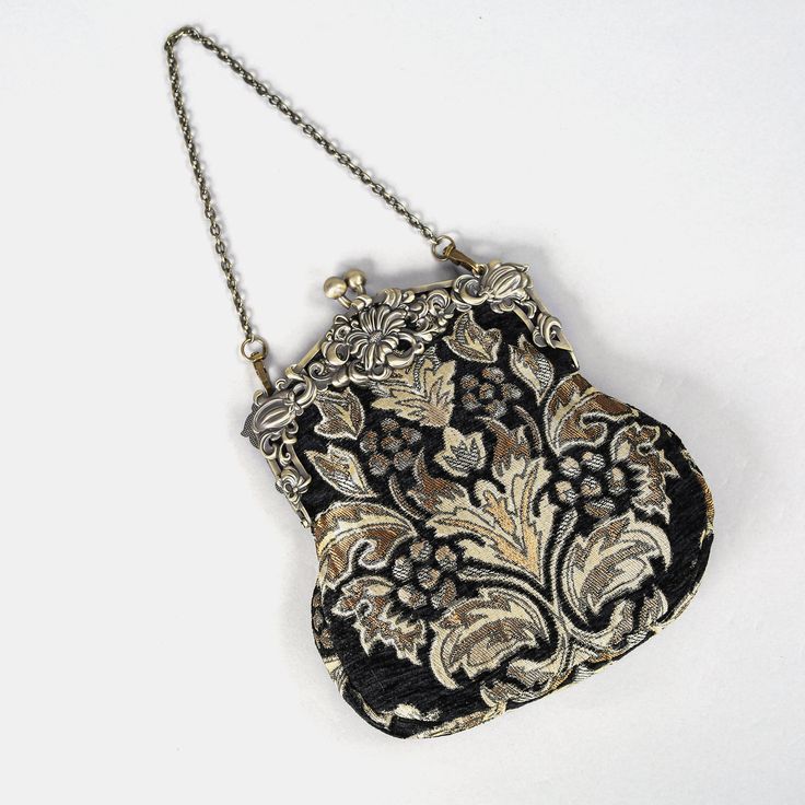 Introducing our captivating collection of Chatelaine purses, inspired by the elegance of the Victorian era.Available in three sizes—Large, Medium, and Small—these purses offer versatility and style. The Large and Medium sizes can be used as both a clutch and a crossbody purse, as we provide two chains for each size: 50" and 13" in length. This allows you to effortlessly switch between crossbody and clutch styles.Let's focus on the Chatelaine Large Crossbody Purse:With a frame width of 6.25" and Vintage Black Bag For Vintage Events, Black Vintage Bags For Vintage Events, Elegant Black Coin Purse For Evening, Vintage Pouch Shoulder Bag For Formal Occasions, Elegant Black Evening Coin Purse, Vintage Black Rectangular Coin Purse, Classic Rectangular Coin Purse For Evening, Elegant Silver Satchel Evening Bag, Classic Rectangular Evening Bag For Vintage Events