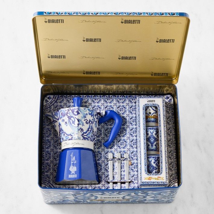 a blue and white tea set in a box