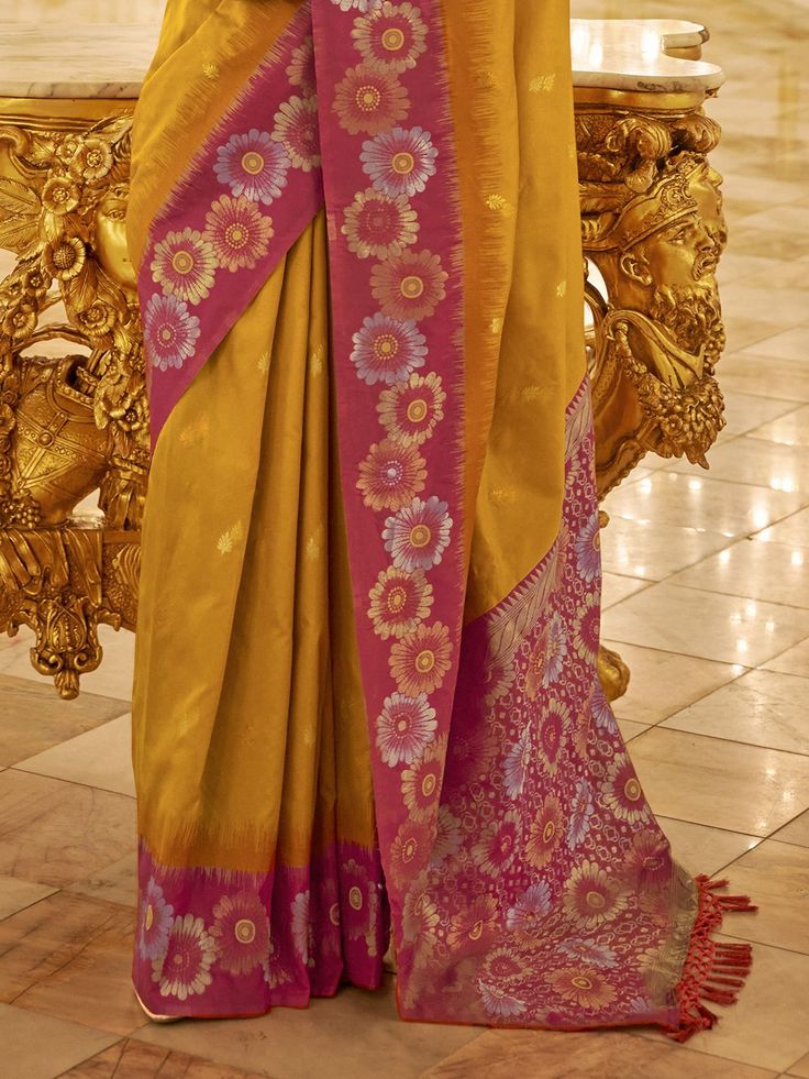 Step into the realm of timeless elegance with this stunning banarasi silk saree, draped in a radiant shade of yellow that exudes vibrancy and charm. Designed to captivate, this saree effortlessly combines traditional craftsmanship with contemporary style, making it an ideal choice for weddings, festivals, and any special occasion. The intricate zari weaving work intricately adorns the fabric, adding a touch of opulence and sophistication to every fold.
With a generous length of 5.50 meters, this Yellow Paithani Silk Anarkali Pre-draped Saree, Traditional Yellow Paithani Silk Pre-draped Saree, Yellow Tussar Silk Pre-draped Saree For Diwali, Gold Paithani Silk Pre-draped Saree, Yellow Handloom Pre-draped Saree For Navratri, Yellow Handloom Pre-draped Saree For Wedding, Festive Yellow Tussar Silk Pre-draped Saree, Festive Yellow Paithani Silk Pre-draped Saree, Yellow Pre-draped Saree For Festivals