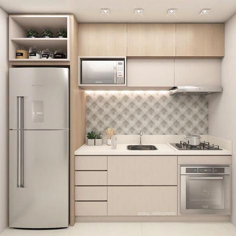 a kitchen with a refrigerator, stove and sink in it's cabinetry area