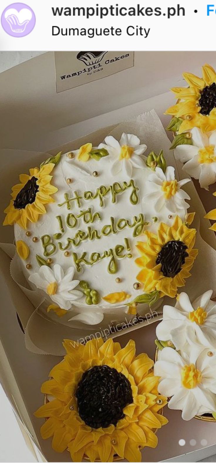 three sunflower decorated birthday cakes in a box