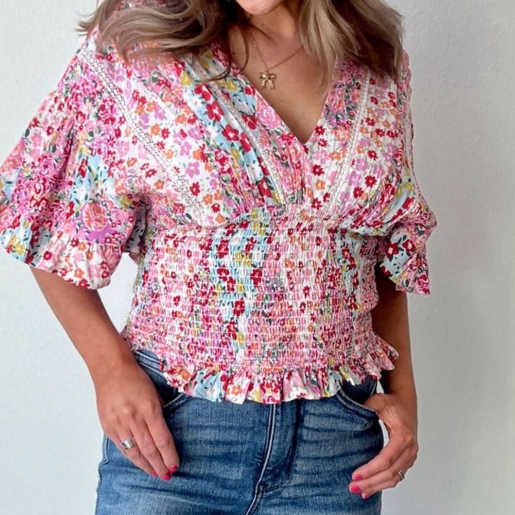 100% Rayon Size: Small Beautiful Floral Print With Lace Detail, Ruffle Sleeves, And Flattering On All Body Types. Multi Colored - Pink, Coral, Blue, White, Green Casual Pink V-neck Smocked Top, Spring Pink Non-stretch Blouse, Spring Floral Print V-neck Smocked Top, Trendy Multicolor Smocked Top With Smocked Back, Floral Print V-neck Smocked Top For Brunch, Trendy Multicolor Smocked Top, Casual Multicolor Top With Smocked Bodice, Feminine Multicolor Tops With Ditsy Floral Print, Spring Multicolor Blouse With Smocked Cuffs