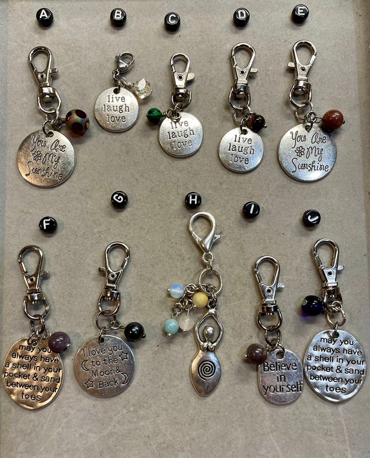 many different types of key chains and charms