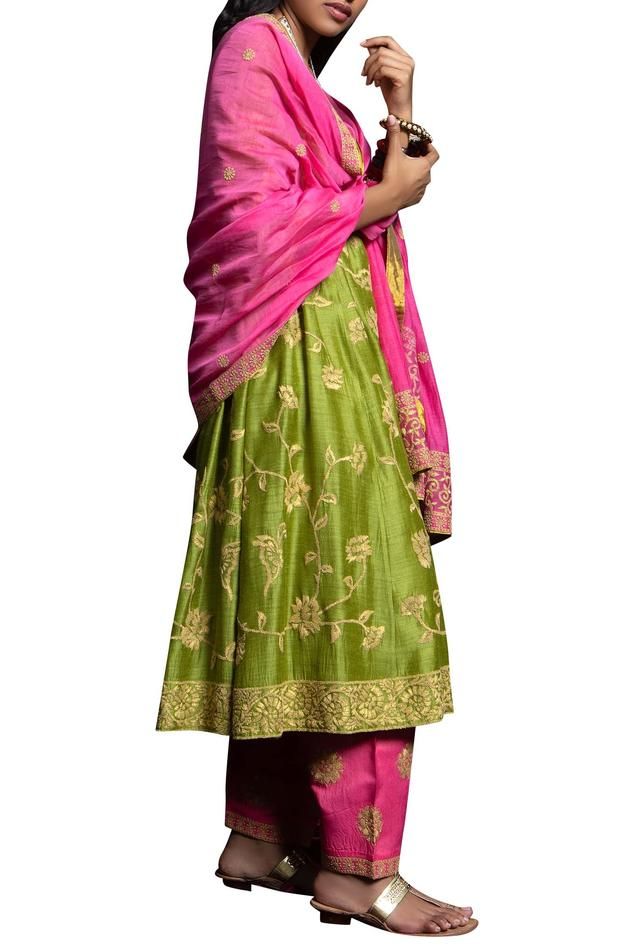 Green long flared kurta with all over floral jaal motif work. Comes with fuschia pink salwar and dupatta.
Components:3
Thread
Neckline:Round
Sleeve Length:Three quarter
Fabric:Matka Silk
Color:Green,Pink
Split neck
Kurta with side gather pleat
Dupatta with border - Aza Fashions Pink Slub Silk Palazzo Set With Zari Work, Tussar Silk Dupatta For Reception, Designer Pink Slub Silk Traditional Wear, Designer Wear Floral Embroidered Anarkali Set, Pink Anarkali Palazzo Set With Floral Embroidery, Green Sharara With Floral Embroidery, Floral Embroidered Slub Silk Saree, Green Floral Embroidered Sharara, Pink Raw Silk Dress With Floral Embroidery