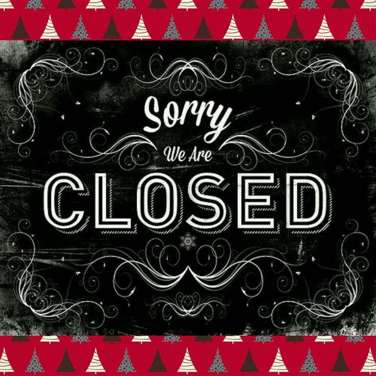 a chalkboard sign that says sorry we are closed on red and white checkered background