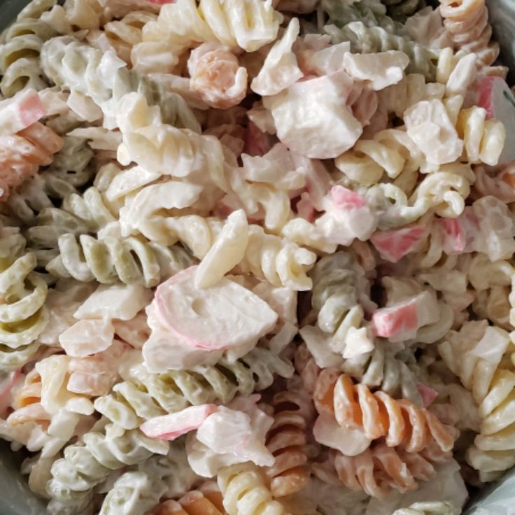 a bowl filled with macaroni and cheese salad