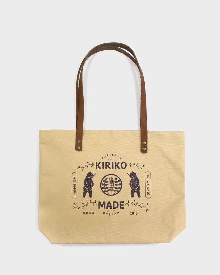 A simple everyday tote to carry your belongings or groceries.     Made here in our Portland studio, with high-quality canvas duck and leather. Screenprinted with Kiriko's kuma mascot. Sewn in Portland, OR Screen printed on one side, blank on the other #10 (14.75 oz) canvas duck Leather handle, antiqued brass rivets One Large Capacity Brown Canvas Bag, Rectangular Cotton Bag With Waxed Finish, Rectangular Cotton Shoulder Bag With Waxed Finish, Rectangular Cotton Bags With Waxed Finish, Casual Double Handle Waxed Canvas Bag, Daily Use Cotton Bags With Waxed Finish, Eco-friendly Waxed Canvas Bag With Canvas Lining, Everyday Canvas Bag With Duck Canvas Lining, Everyday Waxed Canvas Cotton Bag