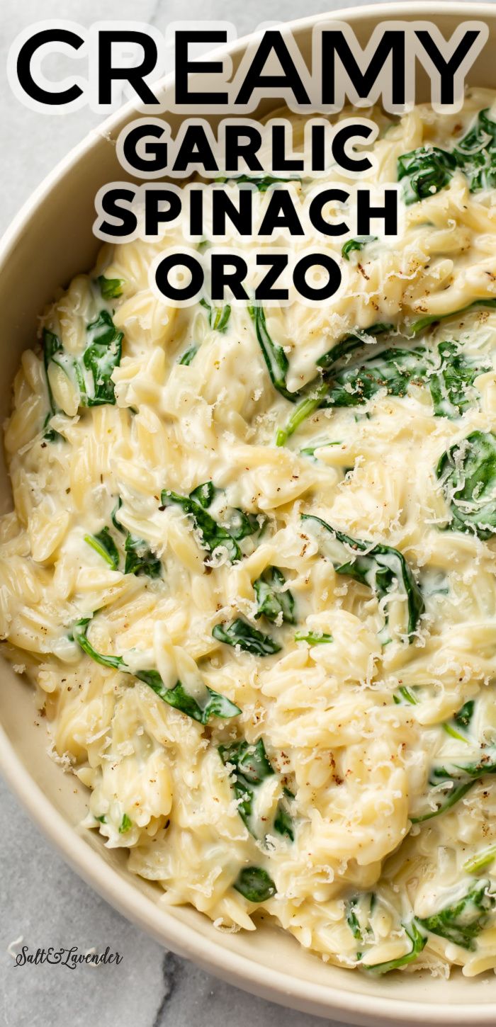 creamy garlic spinach orzo in a white bowl with text overlay that reads, creamy garlic spinach orzo