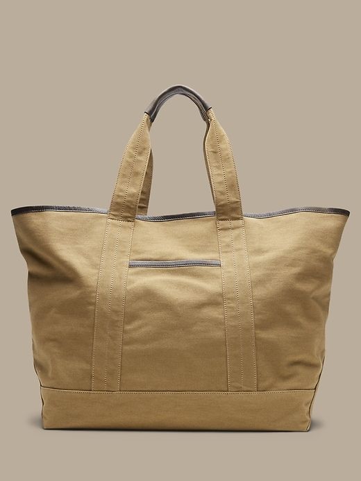 Banana Republic Large Tote Tan with two straps and a side pocket Khaki Rectangular Canvas Travel Bag, Large Capacity Brown Canvas Bag, Beige Canvas Travel Bag With Double Handle, Large Capacity Khaki Canvas Travel Bag, Khaki Canvas Shoulder Bag With Canvas Lining, Khaki Canvas Travel Bag For Everyday Use, Everyday Use Khaki Canvas Travel Bag, Khaki Shoulder Bag With Canvas Lining, Casual Double Handle Waxed Canvas Bag