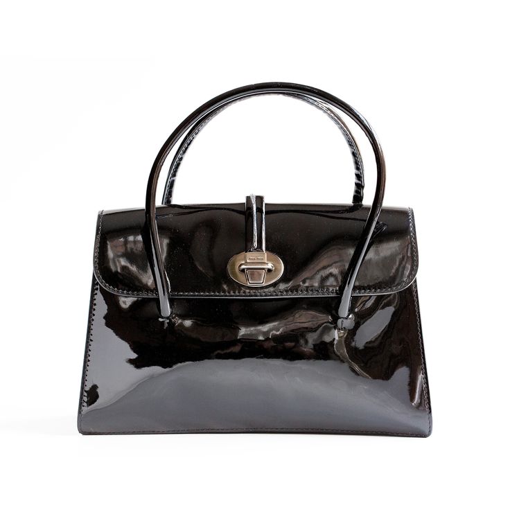 "MIU MIU vintage black patent leather top handle handbag in excellent/mint condition. It is made in Italy and in alignment with all the very high quality Miu Miu products. This black patent leather purse has a mint condition tan suede interior with 3 different divided compartments. This handbag is right on trend with the season's handbag picks! The dimensions of this handbag are: Height (with handles): 10\" Height (without handles): 6.5\" Width: 2.5\" Length (left to right): 9\" Thank you for looking! If you have any questions feel free to reach out!" Designer Black Bags With Glossy Finish, Sleek Black Glossy Shoulder Bag, Classic Black Bag With Glossy Finish, Classic Black Bags With Glossy Finish, Luxury Black Patent Leather Bag, Luxury Black Patent Leather Shoulder Bag, Luxury Shoulder Bag With Glossy Finish And Double Handle, Evening Bags With Glossy Finish And Double Handle, Designer Patent Leather Bag With Glossy Finish