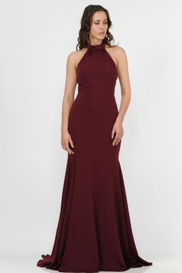 Make an impact in this long high-neck halter dress with mermaid train by Poly USA 8252. This beautiful formal gown features a high neck halter bodice, flirty open back, floor length mermaid skirt with sweep train, and a zipper closure. Affordably priced at $189, this long evening dress is perfect for any formal event and will keep you on budget! Designer: Poly USA Style Number: 8252 Material: Jersey, Polyester Details: Bra Cup, Fully Lined Fit: The model is 5'9" Length: Dress 64", Hollow to Hem 63" Colors: Black, Burgundy, Royal Blue, Rose Gold This item ships within 1 to 2 business days. Mermaid Dress With Train, High Neck Halter Dress, Open Back Prom Dress, Back Prom Dress, Dress With Train, High Neck Halter, Halter Gown, Bra Cup, Mermaid Skirt