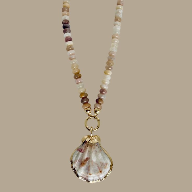 The Aventurine Ava Necklace Is A Timeless Addition To Any Jewelry Collection. Featuring Pink Aventurine Rondelle Stones With Warm, Soft Pinkish Earth Tones And Gorgeous Gold Plated Accents, This Necklace Stands Out From The Rest. Secured With A Push Spring Clasp That Showcases A Beautiful Scallop Shell Trimmed In Gold, This Necklace Is Sure To Impress. *Tarnish Resistant *Color And Size Of Seashell May Vary Length: Approx 17” Gold Shell Necklace With Gemstone Beads As Gift, Gold Shell Necklace With Natural Stones, Gold Shell Necklace With Natural Stones As Gift, Necklace Stands, Pink Aventurine, Necklace Stand, Scallop Shell, Scallop Shells, Shell Jewelry