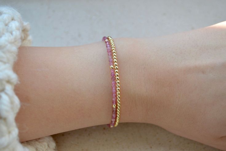 This tiny pink tourmaline beaded bracelet with gold plated hematite beads is a perfect bridesmaid gift or Christmas present for Her. These dainty minimalist beaded 2mm gemstone bracelets look amazing together. . ❗️Sign up to our Newsletter and get 15% OFF your order (copy this link to browser search) - https://forms.gle/R74xLdL1MSmC9Apn6 ❗️ . If you need to buy two bracelets with different length feel free to write me a message, all bracelets are made to order so I can personalize everything you Dainty Pink Gold Jewelry For Everyday, Dainty 14k Pink Gold Jewelry, Adjustable 14k Gold Beaded Bracelets With Tiny Beads, Delicate Adjustable 14k Gold Beaded Bracelet, Adjustable Delicate 14k Gold Beaded Bracelet, Elegant Rose Gold Jewelry With Gemstone Beads, Delicate Faceted Beaded Bracelets For Everyday, Adjustable Dainty Pink Gold Bracelets, Dainty Beaded Bracelets With Round Beads For Bridesmaid Gift