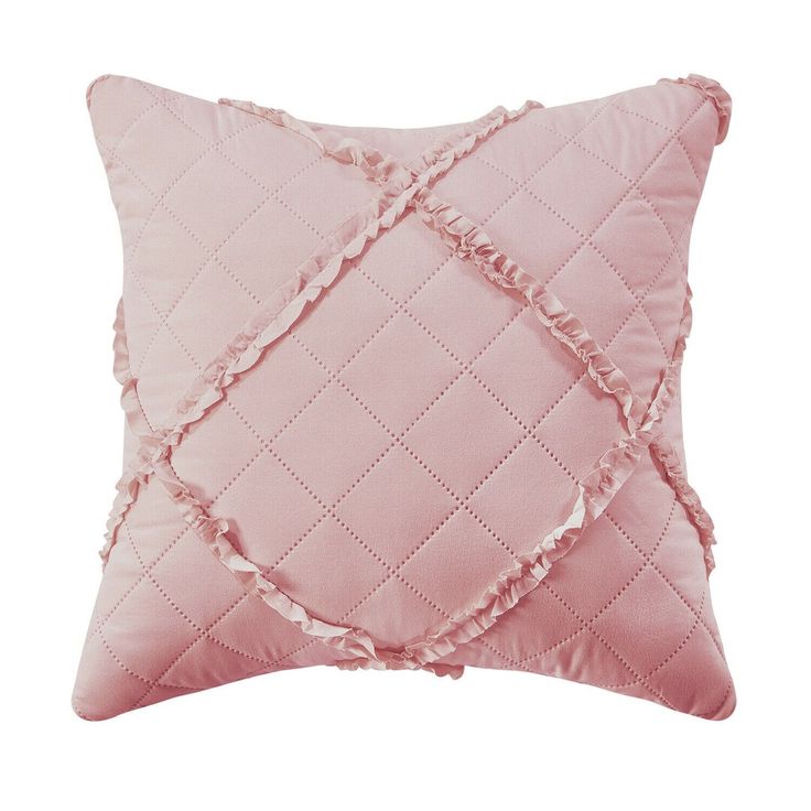 a pink pillow with ruffled edges