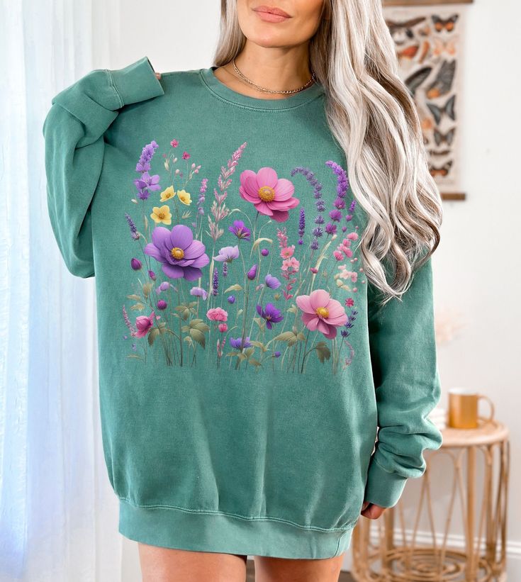 This gorgeous Comfort Colors sweatshirt features elegant, nature inspired Lavender and Wildflowers design!  Luxurious comfort and style are what this unisex, garment-dyed sweatshirt is all about. It's made with 80% ring-spun cotton and 20% polyester and the fabric is 3-end garment-dyed, ring-spun, color-blast fleece with a 100% cotton face. Each sweatshirt comes with a relaxed fit, a rolled-forward shoulder, and a back neck patch.   .: 80% ring-spun cotton, 20% polyester .: Medium-heavy fabric ( Soft-washed Cotton Sweater For Spring, Spring Crew Neck Soft-washed Sweater, Soft-washed Crew Neck Sweater For Spring, Spring Bohemian Cotton Sweatshirt, Casual Tie Dye Tops With Floral Print, Soft-washed Long Sleeve Spring Sweater, Spring Long Sleeve Soft-washed Sweater, Soft-washed Long Sleeve Sweater For Spring, Spring Tie Dye Relaxed Fit Sweatshirt