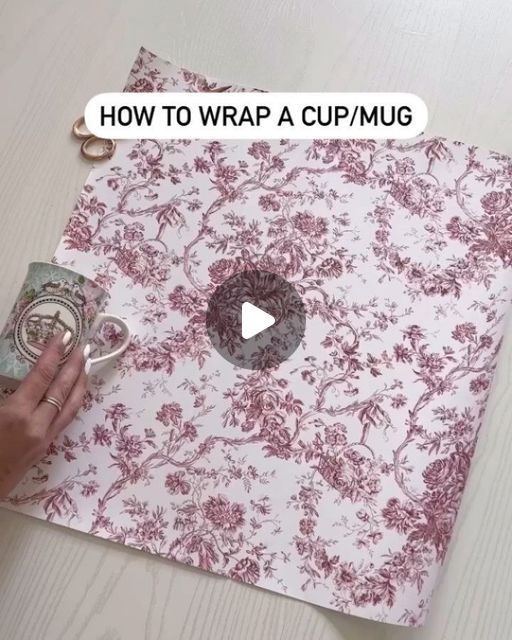 someone is wrapping a cup / mug on top of a table with the words how to wrap a cup / mug