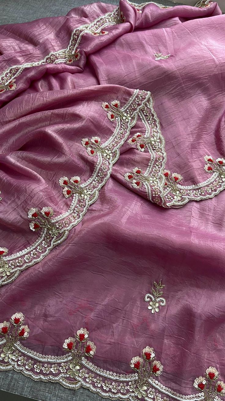 This luxurious saree is made from 100% pure soft crush silk, adorned with delicate thread work, sequins, and zardozi, giving it a rich, handcrafted feel. The intricate detailing of zardozi, kora, gota patti, pearls, and sequins creates a stunning visual appeal, perfect for special occasions and festive celebrations. Paired with a pure Munga silk blouse, this saree is a masterpiece of traditional craftsmanship. Fabric of Saree: 100% Pure Soft Crush Silk Work: Zardozi, Kora, Gota Patti, Pearl, Anc Elegant Dola Silk Pre-draped Saree With Resham Embroidery, Bollywood Style Purple Raw Silk Pre-draped Saree, Bollywood Style Pre-draped Saree For Wedding Festivities, Pre-draped Art Silk Saree With Dori Work For Wedding, Festive Pink Raw Silk Pre-draped Saree, Wedding Saree With Semi-stitched Blouse, Bollywood Style Tissue Silk Pre-draped Saree For Designer Wear, Elegant Pink Pre-draped Saree In Tussar Silk, Designer Pre-draped Dola Silk Saree With Dupatta