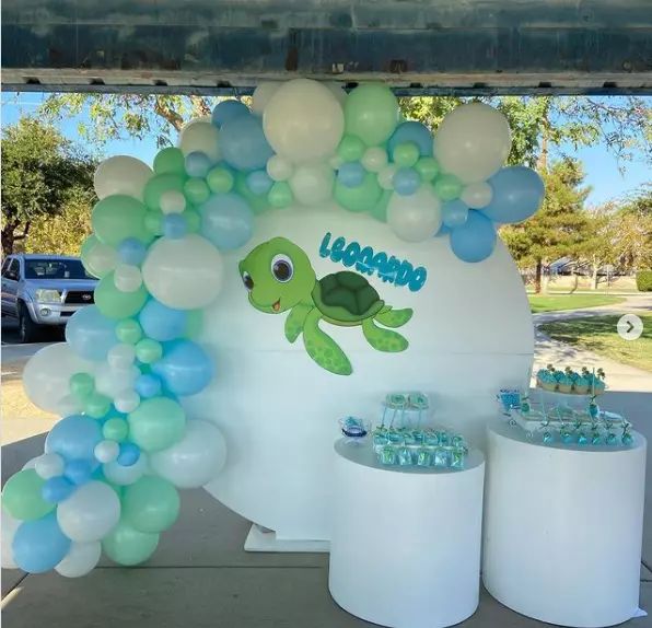 a turtle themed birthday party with balloons and streamers