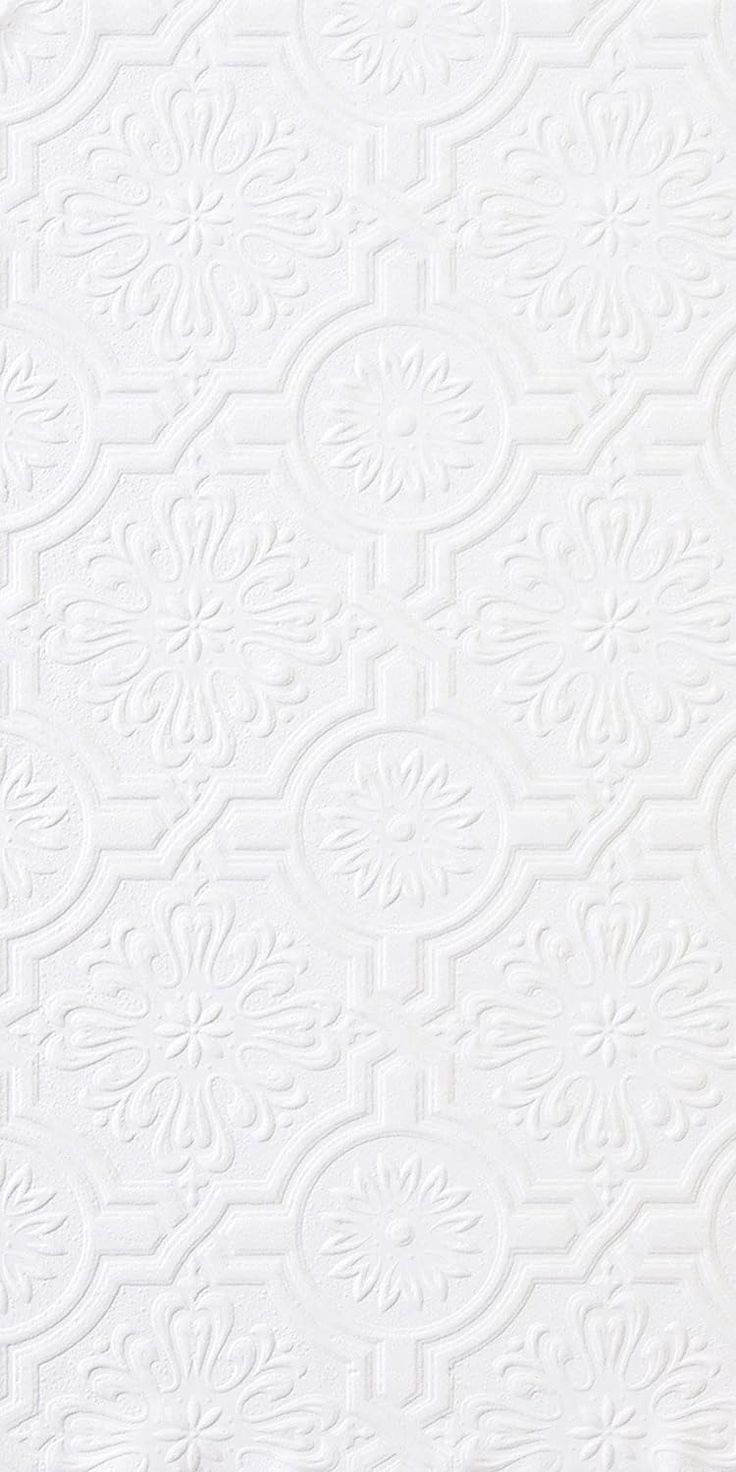 white wallpaper with an intricate design on it