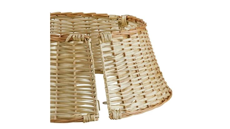 a wicker lamp shade on a white background