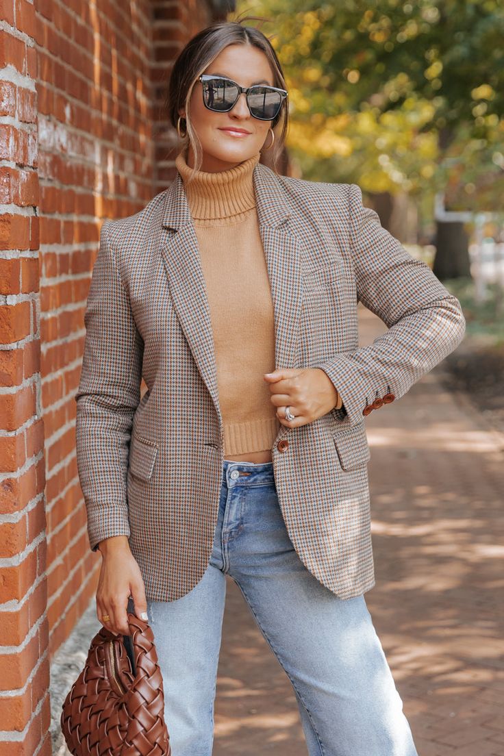 The Boss Babe Oversized Plaid Blazer is a must-have for any stylish professional! With its long sleeves, buttoned cuffs, and notched collar, this blazer exudes confidence and power. The oversized fit and allover plaid pattern add a touch of trendy flair. Made from high-quality materials, this blazer will keep you comfortable and stylish all day long. Layer it over a basic tank top or bodysuit and then pair with jeans, ankle booties, and a matching crossbody bag for an elevated boho chic look! Oversized Single Button Long Sleeve Blazer, Chic Business Casual Blazer For Fall, Oversized Fall Blazer With Button Cuffs, Oversized Business Casual Blazer With Lapel Collar, Trendy Fall Blazer With Notch Lapel, Casual Fall Blazer With Button Cuffs, Oversized Notch Lapel Blazer For Business Casual, Oversized Blazer With Button Cuffs For Fall, Oversized Lapel Collar Blazer For Business Casual